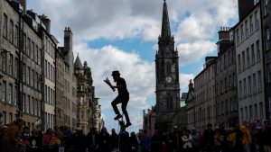 A juggler performs on the Royal Mile in Edinburgh. IMAGE: JEFF J MITCHELL/GETTY