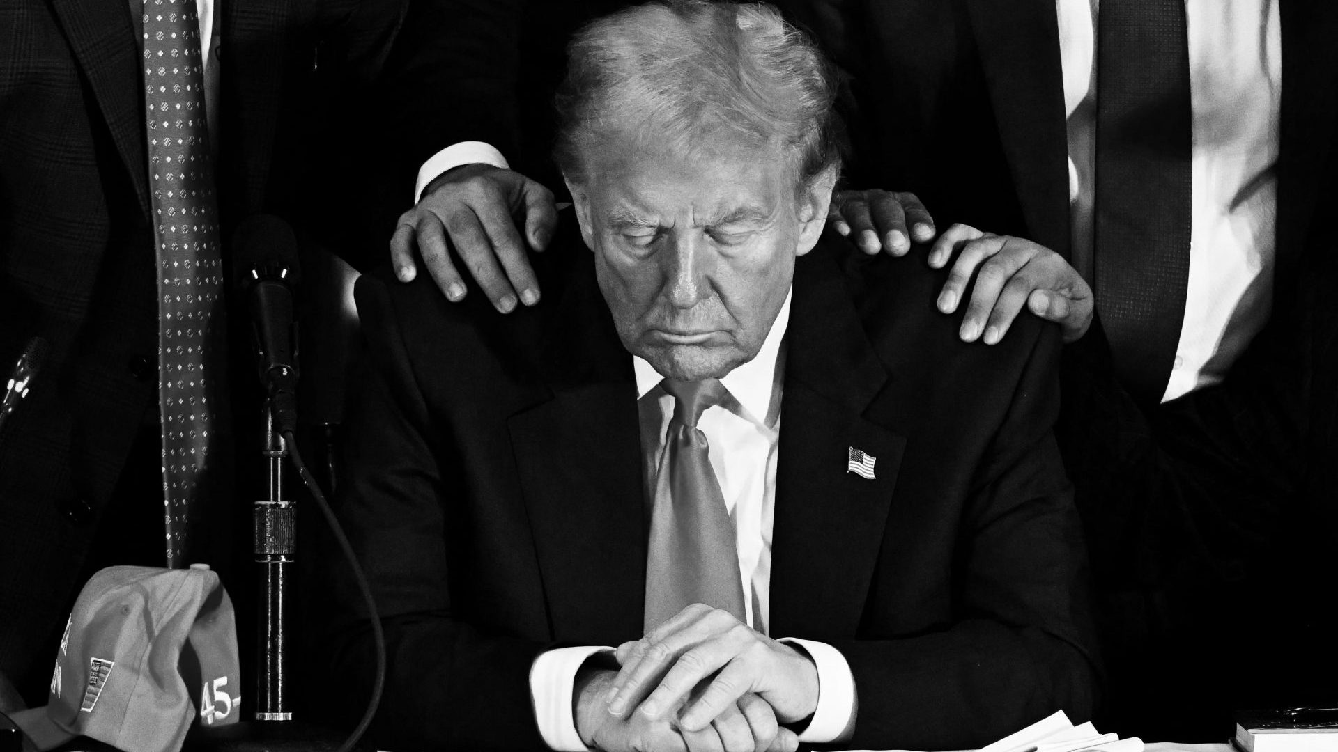 Donald Trump prays during a roundtable discussion with Latino community leaders at Trump National Doral Miami. Photo: CHANDAN KHANNA / AFP) (Photo by CHANDAN KHANNA/AFP via Getty Images
