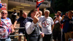 Stephen Yaxley-Lennon, also known as Tommy Robinson, gestures to members of the media as he leaves Southwark Crown Court. Photo: Leon Neal/Getty Images