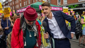 GB News presenter Ben Leo asks a protestor questions during an anti-racism demonstration. Photo: James Willoughby/SOPA Images/LightRocket via Getty Images 
