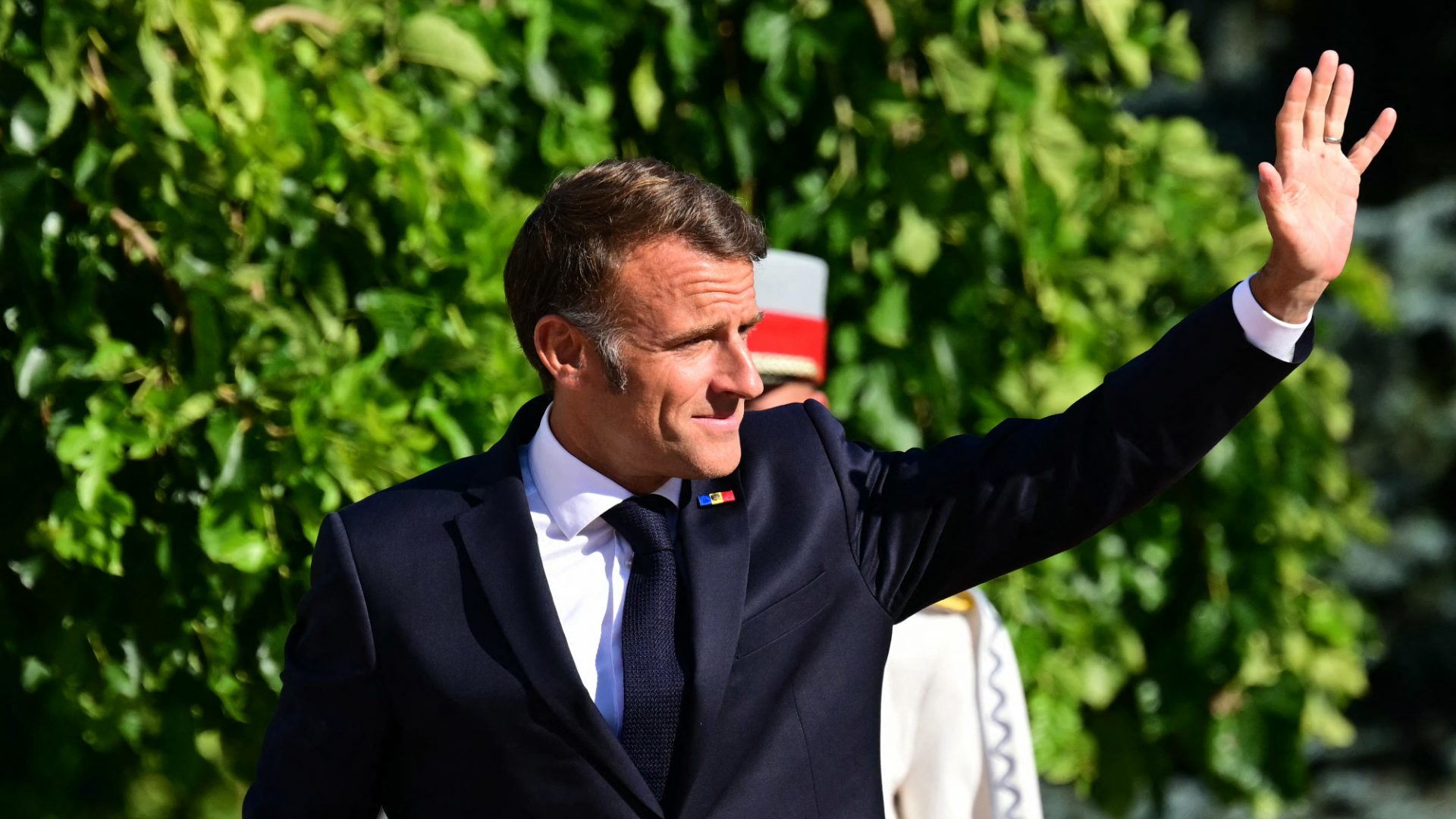  Emmanuel Macron waves as he arrives at the Moldova's Presidency in Chisinau. Image: Daniel Mihailescu/AFP/Getty Images 