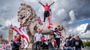  Protesters wave Union Jack and St George's England flags during the "Unite The Kingdom" rally on Westminster Bridge. Photo: Christopher Furlong/Getty Images