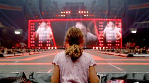 A fan watches Taylor Swift perform on stage during "Taylor Swift | The Eras Tour" at Johan Cruijff Arena, Amsterdam. Photo: Aldara Zarraoa/Getty Images for TAS Rights Management