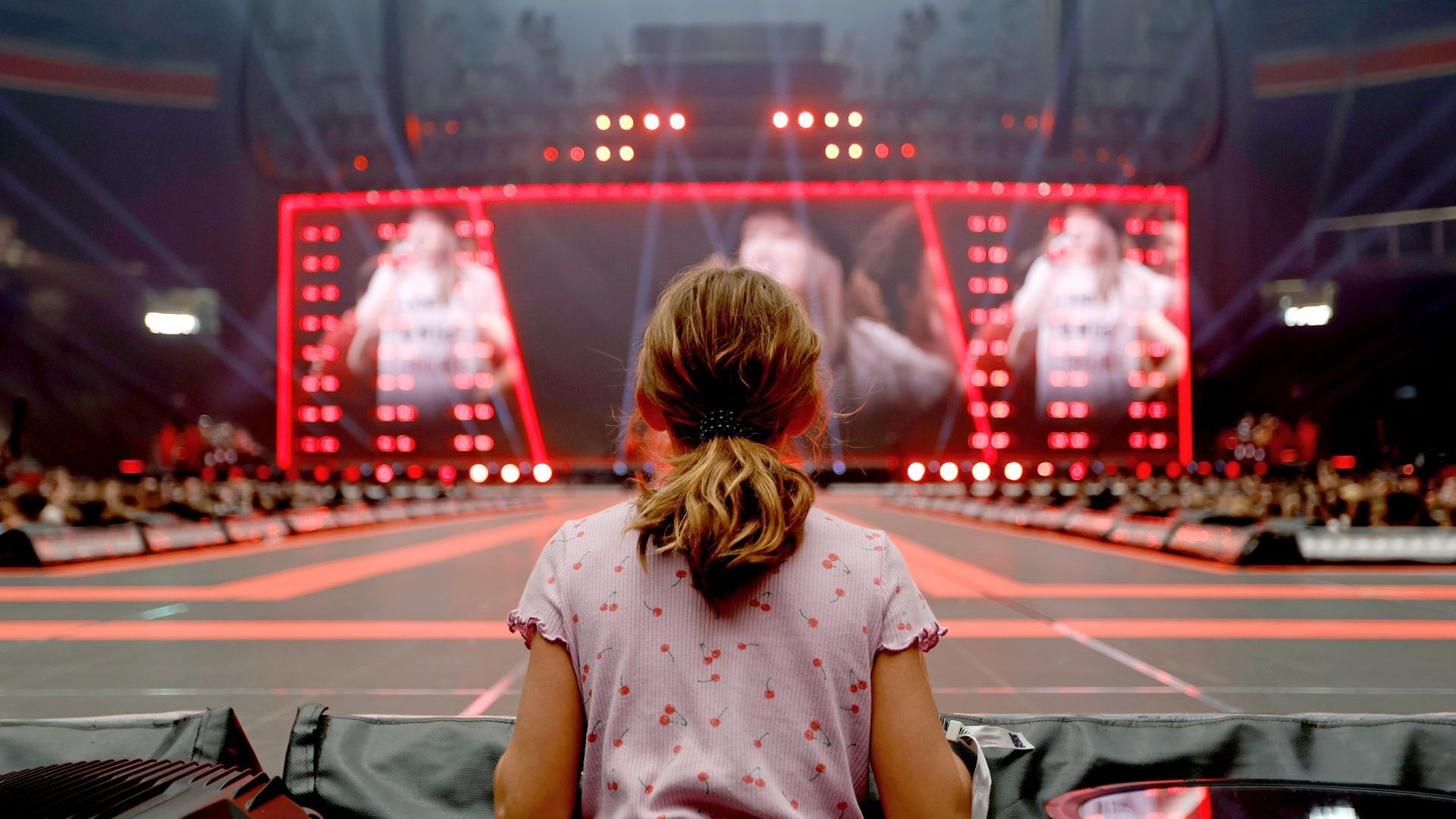 A fan watches Taylor Swift perform on stage during "Taylor Swift | The Eras Tour" at Johan Cruijff Arena, Amsterdam. Photo: Aldara Zarraoa/Getty Images for TAS Rights Management
