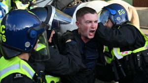 Clashes erupt between police and protesters as thousands of people march through central London. Photo:  Rasid Necati Aslim/Anadolu via Getty Images