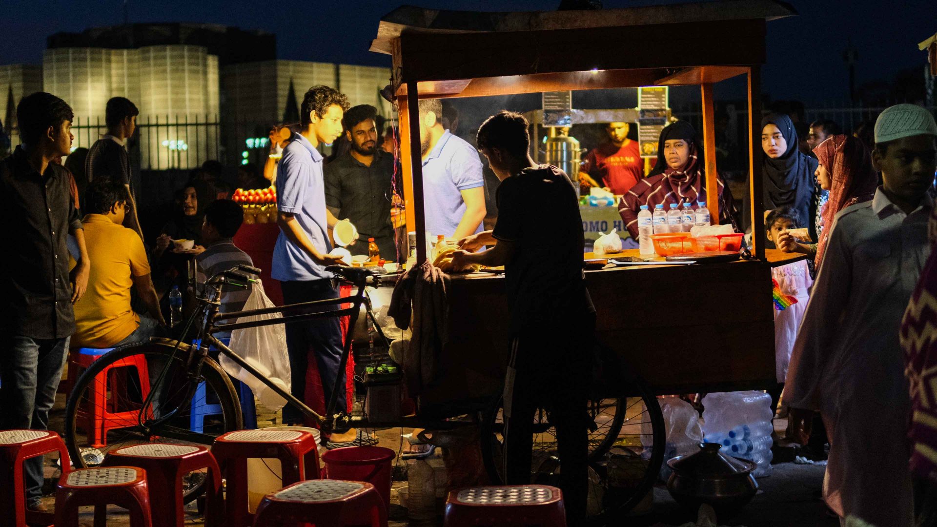 Vendors prepare food at stalls as visitors gather at the National Parliament area in Dhaka, Bangladesh. Photo: Syed Mahamudur Rahman/NurPhoto via Getty Images
