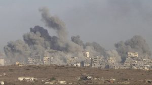 Smoke rises over the Gaza Strip after an Israeli bombardment as seen from a position on the Israeli side of the border on October 5. Photo: Amir Levy/Getty Images