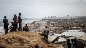 Daily life continues in Gaza as Palestinians in Deir al Balah wait for the agreed ceasefire to take effect. Image: Ali Jadallah/Anadolu/Getty
