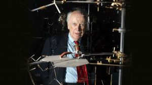 Dr James Watson poses with the original DNA model ahead of a press conference at the Science museum in London, 20 May 2005. Dr. Watson discovered the structure of DNA in 1953. Photo: ODD ANDERSEN/AFP via Getty Images