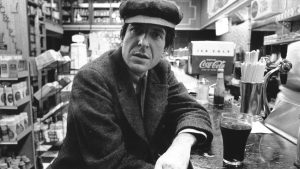 Canadian poet, singer songwriter and novelist Leonard Cohen in a diner in New York, c. 1968. Image: Roz Kelly/Michael Ochs Archives/Getty