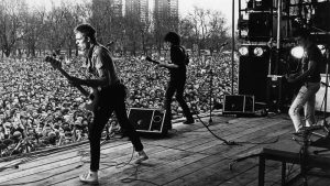 Paul Simonon, Mick Jones and Joe Strummer of The Clash on stage at the Rock Against Racism carnival in Victoria Park, Hackney, April 30, 1978. Image: Val Wilmer/Redferns/Getty