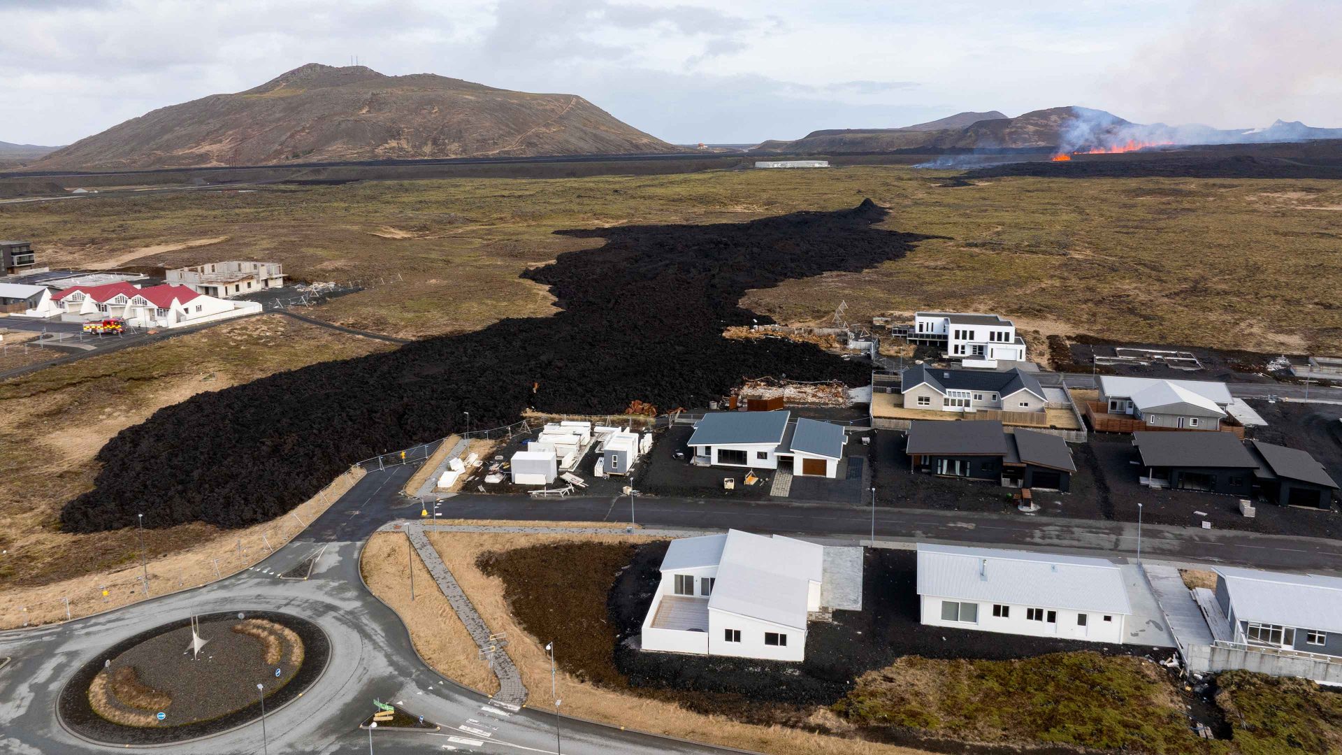 Molten lava is seen coming out of a fissure on the outskirts of the fishing village Grindavik in southwest Iceland. Photo: AEL KERMAREC/AFP via Getty Images
