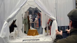 An artwork by German artist Victoria-Maria showing the Christmas nativity scene with faceless characters is displayed on the Grand-Place in Brussels. Photo: Nicolas TUCAT / AFP via Getty Images