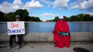 A protester in Washington is dressed as a handmaid from The Handmaid’s Tale. Image: Kevin Dietsch