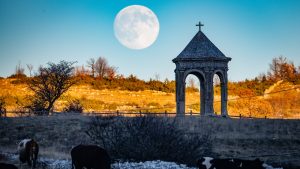 A full moon rises behind Palco della Rimembranza monument in Terranera, Italy, where the festive season is now celebrated in the summer. IMAGE: Lorenzo Di Cola/NurPhoto/Getty