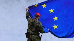 Soldiers of the German armed forces Bundeswehr hoist a European flag in front of the Bundeswehr memorial. Photo: TOBIAS SCHWARZ/AFP via Getty Images