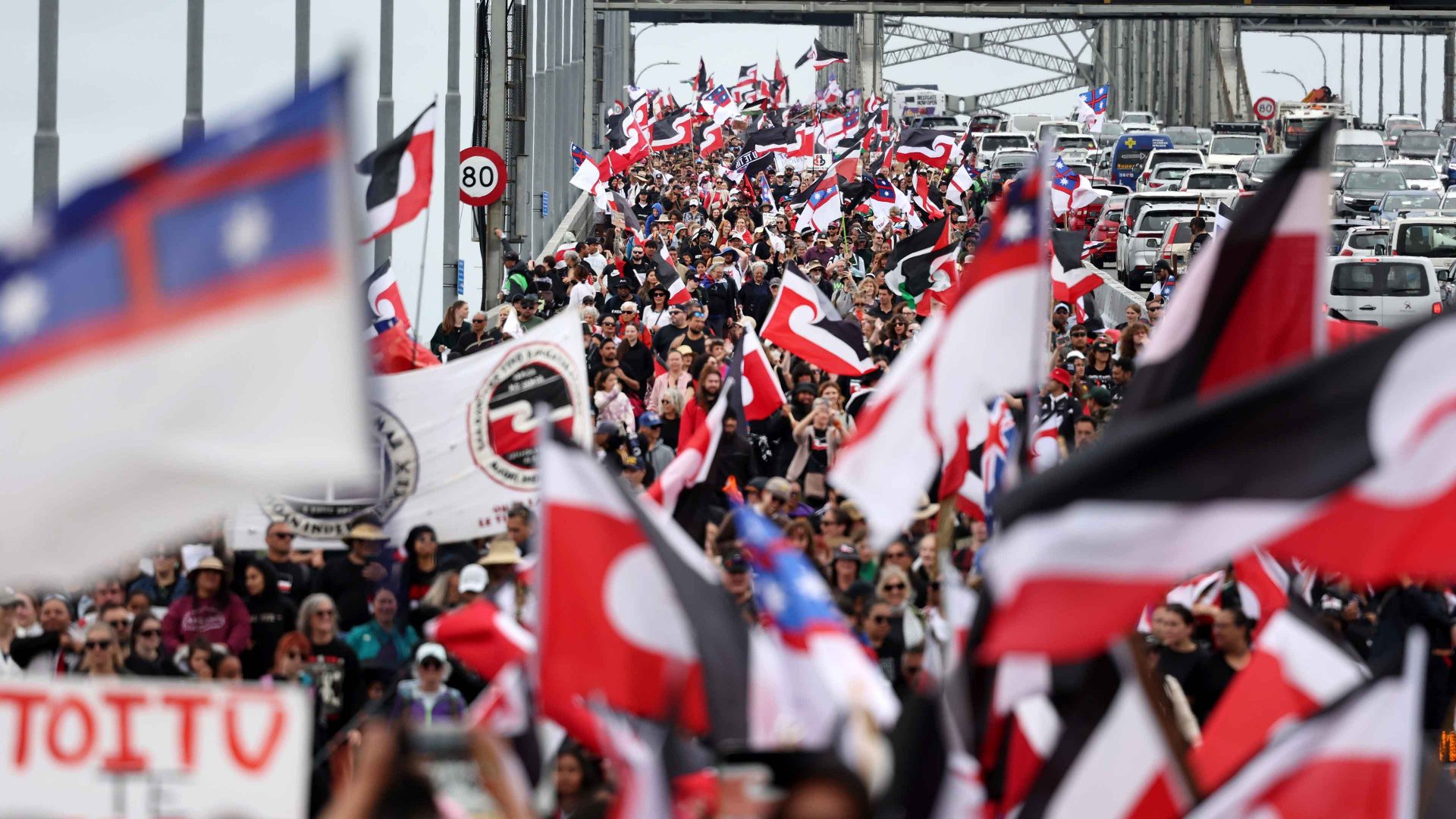 Hikoi members walk across the Auckland Harbour Bridge on day three of a nine-day journey to Wellington. Photo: Fiona Goodall/Getty Images
