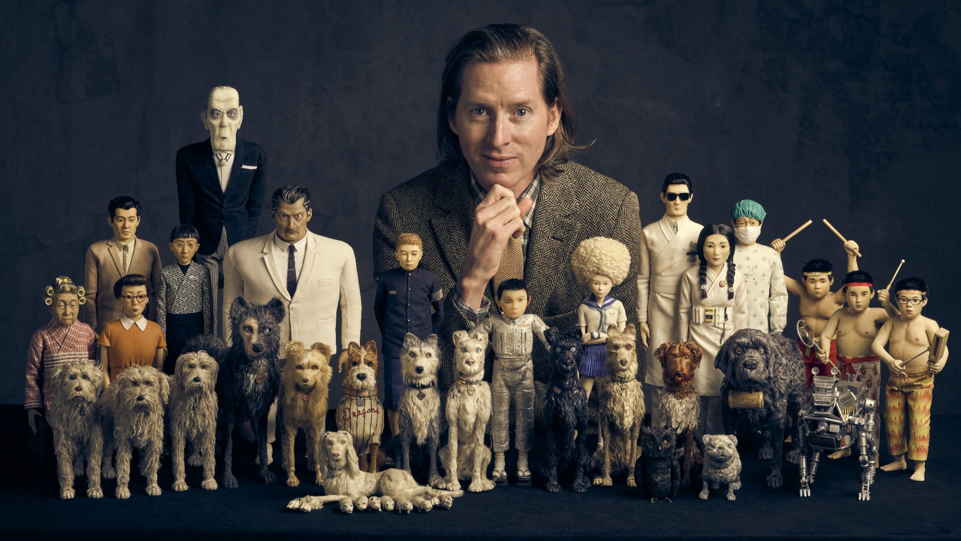 Wes Anderson, left, with figures from Isle of Dogs. Image: Searchlight Pictures/Charlie Gray