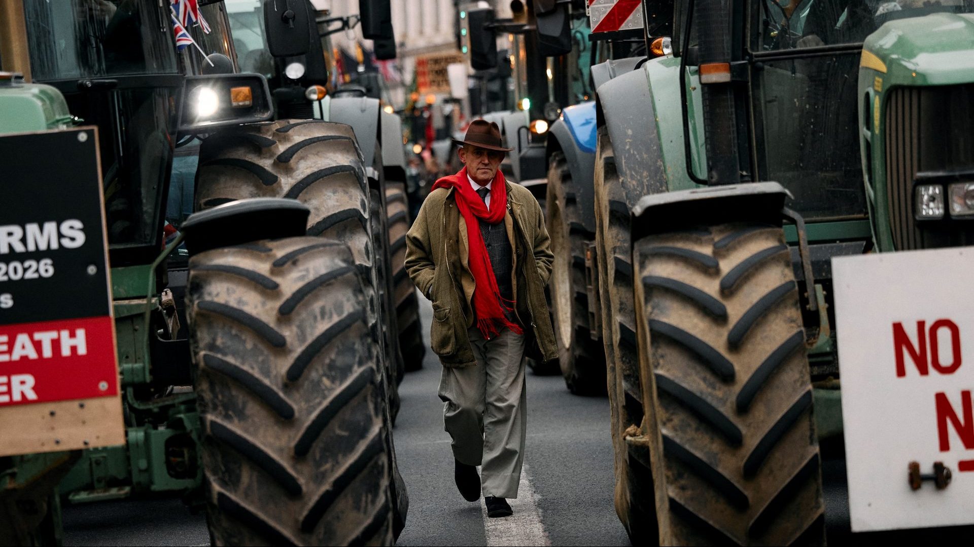Gawain Towler walks among tractors parked along Whitehall during a stop "the death of British Farming" demonstration. Photo: BENJAMIN CREMEL/AFP via Getty Images