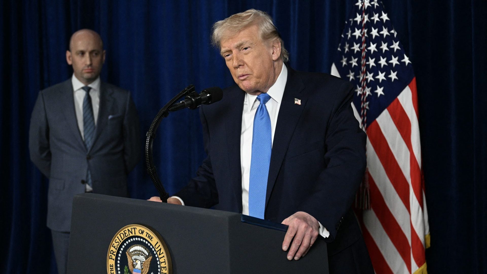 Deputy chief of staff Stephen Miller looks on as US president Donald Trump speaks to the press following US military actions in Venezuela. Photo: Jim WATSON / AFP via Getty Images