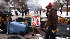 Demonstrators gather at the street where 37-year-old Renee Nicole Good was shot and killed at point blank range on January 7 by a US Immigration and Customs Enforcement (ICE) agent. Photo: CHARLY TRIBALLEAU / AFP via Getty Images