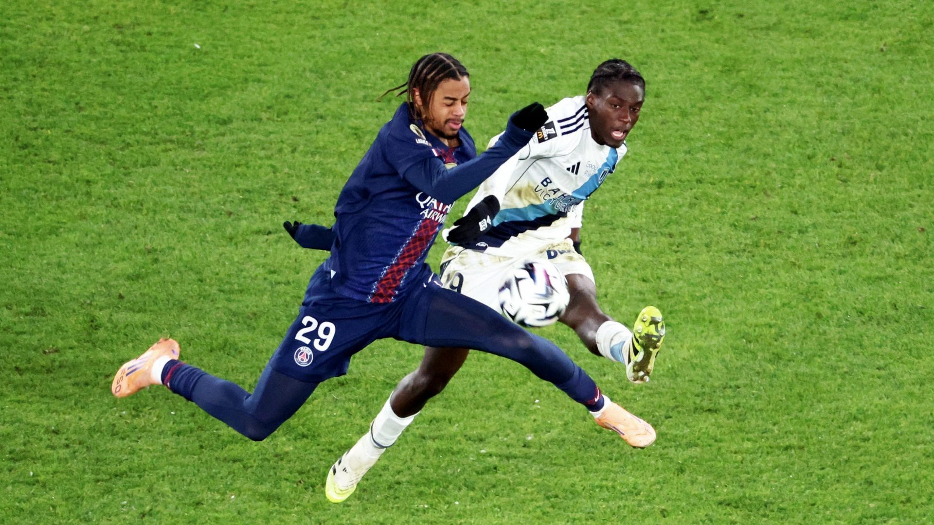Bradley Barcola #29 of Paris Saint-Germain in action with Nhoa Sangui #19 of Paris FC during the Ligue 1 McDonald's 2025-2026 match between Paris Saint-Germain and Paris FC at Parc des Princes. Photo: Xavier Laine/Getty Images