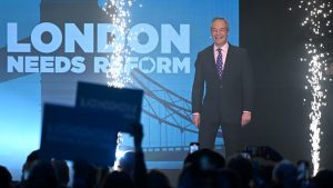 Nigel Farage on stage during a Reform UK rally held at Excel London's ICC Auditorium. Photo: Leon Neal/Getty Images