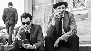 Guillaume Marbeck as Jean Luc Godard and Aubry Dullin as Jean-paul Belmondo in Nouvelle Vague. Photo: Jean-Louis Fernandez/Courtesy of Netflix