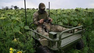 A Ukrainian soldier controls an unmanned ground vehicle during a training session in eastern Ukraine, August 2025. Image: Genya SAVILOV/AFP/GETTY