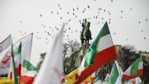 Demonstrators wave Iranian flags during a rally at Trocadéro Square in Paris on March 7. Image: LAURE BOYER/HANS LUCAS/AFP/GETTY