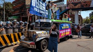 Jeepney drivers and activists take part in a protest as transport workers stage a strike over surging fuel costs. Photo: Ezra Acayan/Getty Images