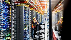 A technician works at an Amazon Web Services AI data center in New Carlisle, Indiana. Photo: Noah Berger/Getty Images via Amazon Web Services