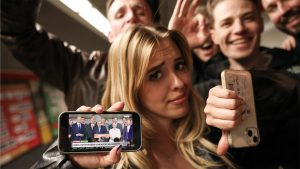 Joyful revellers in an underground metro station show the live transmitted statement of Viktor Orban conceding defeat. Photo: Sean Gallup/Getty Images