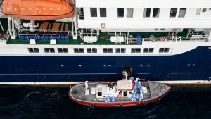 Health personnel assisting patients onto a boat from the cruise ship MV Hondius, while stationary off the port of Praia, the capital of Cape Verde. Photo: AFP via Getty Images