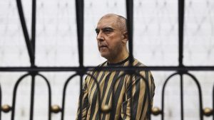 Former head of political security in south Syria's Daraa province, Atif Najib attends the first trial session at the Palace of Justice. Photo: Bakr ALkasem / AFP via Getty Images