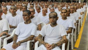 Prisoners attend a massive hearing against criminals and gang members at the Cecot mega-prison on April 23 in Tecoluca, El Salvador. Image: Alex Peña/Getty