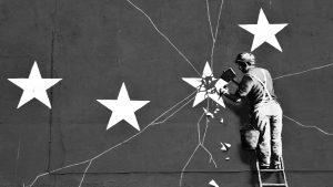 A Banksy mural of a workman chipping Britain’s star off the EU  flag appeared in Dover in 2017. IMAGE: GLYN KIRK/AFP/GETTY/TNW