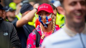A supporter wears a mask depicting U.S. President Donald Trump during a march organized by the UK Independence Party calling for mass deportations on July 26, 2025. Photo: Andrew Harnik/Getty Images