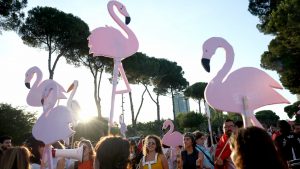 Protestors hold cartoon flamingos as they gather in front of Albania's Prime Minister's Office in Tirana. Photo: Adnan Beci / AFP via Getty Images