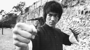 Actor and martial artist Bruce Lee rehearsing on the set of Enter the Dragon, Hong Kong, 1973. Image: Stanley Bielecki Movie Collection/Getty