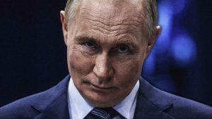Vladimir Putin grimaces during his meeting with participants of the Russia International Exhibition-Forum. Image: TNW/Getty