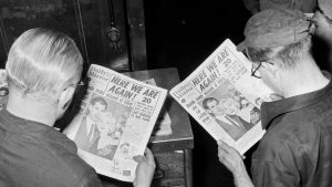 Two Mirror Group production staff look at the front page of the Daily Mirror of April 21, 1955, which ran the story of Ruth Ellis, accused of killing her lover, David Blakely, Image: Dean/Daily Mirror/Mirrorpix/Getty
