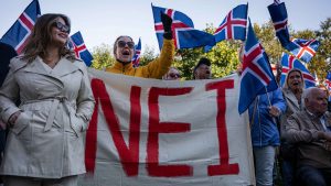 Supporters of the 'No' campaign display a banner during a rally against reopening Iceland's European Union accession negotiations in Reykjavik. Photo: Jonathan NACKSTRAND / AFP via Getty Images