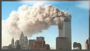 Smoke pours from the World Trade Centre after it was hit by two hijacjked passenger planes September 11, 2001 in New York City in an alleged terrorist attack. Photo: Robert Giroux/Getty Images. Image design: TNW