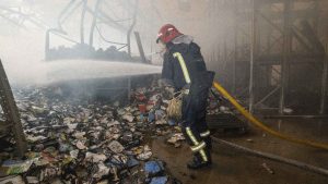 Firefighters respond to area after two Russian attack drones struck a book warehouse destroying part of the building and sparking a fire that spread across 8,900 square meters in Kharkiv, Ukraine. Photo: Serhii Masin/Anadolu via Getty Images