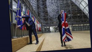 EU Council staff members remove the UK flag from the European Council building in Brussels on Brexit Day, January 31, 2020. Image: Olivier Hoslet/Pool/AFP/Getty