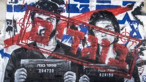 A graffiti mural depicting Israeli filmmakers Yuval Abraham and Rachel Szor, directors of the documentary 'NAZA'- which documents civilian deaths in Gaza. Photo: Mostafa Alkharouf/Anadolu via Getty Images