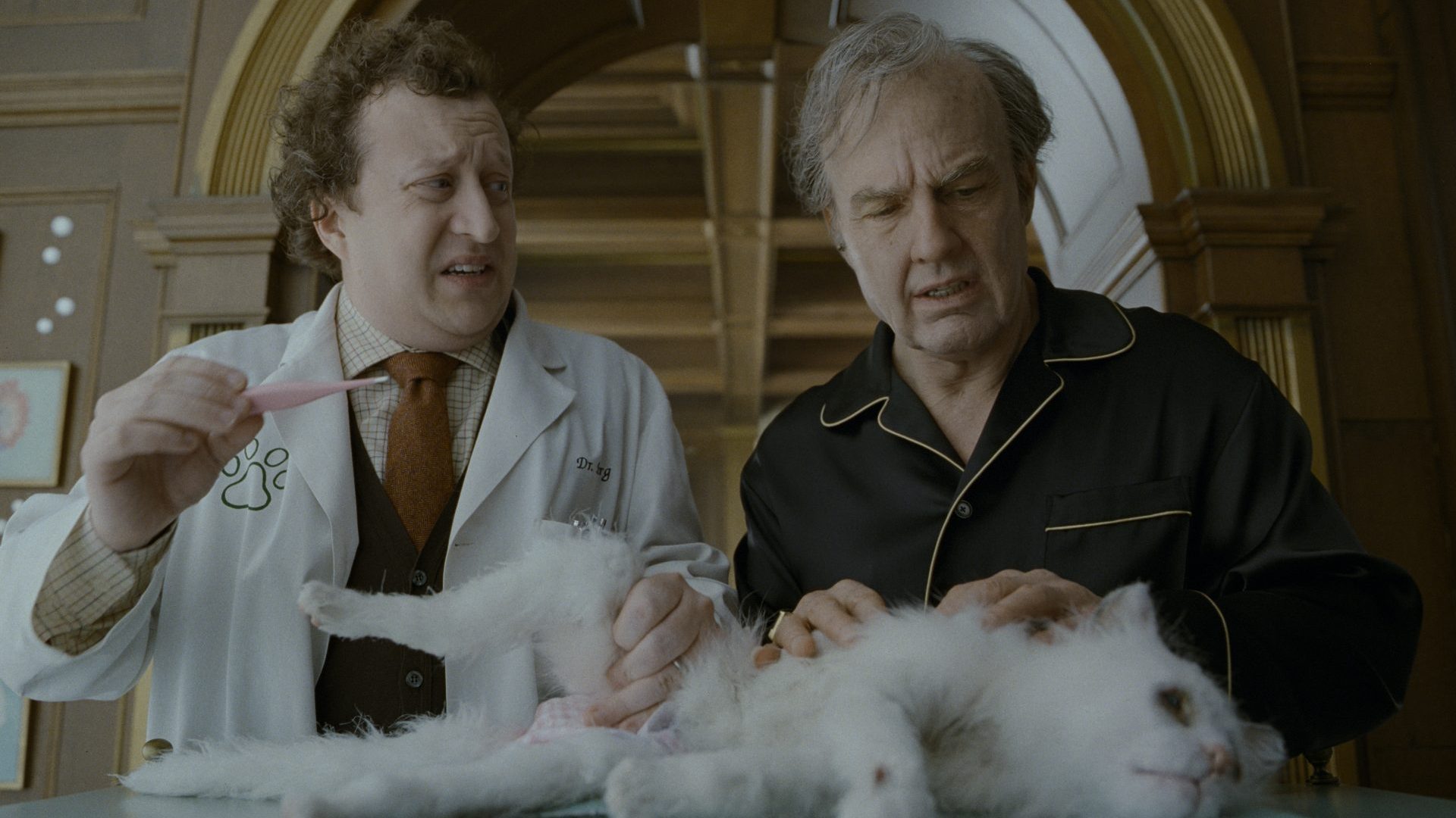 Ross Hatt as Dr. Berg, Tom Cruise as Rockwell with Maggie the cat in Digger. Credit: Warner Bros. Pictures